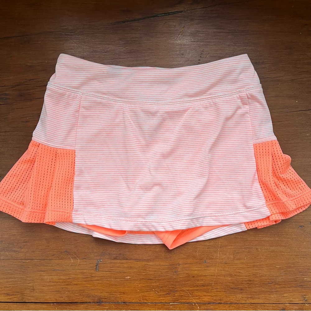 Girls pink and orange Champion tennis skort, size 7/8